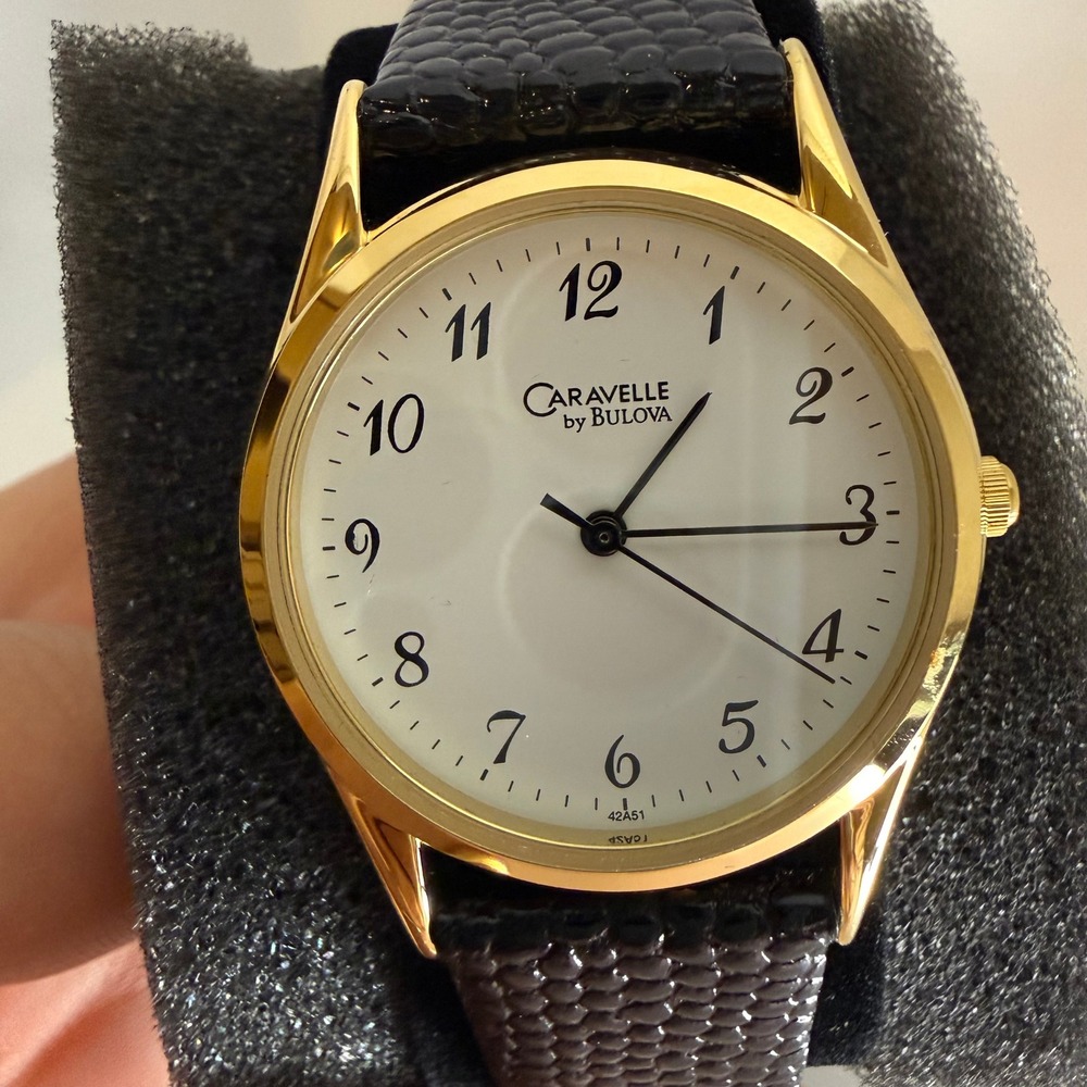 Caravelle by Bulova Mens Watch 42A51 Gold Tone White Dial Black Leather Strap